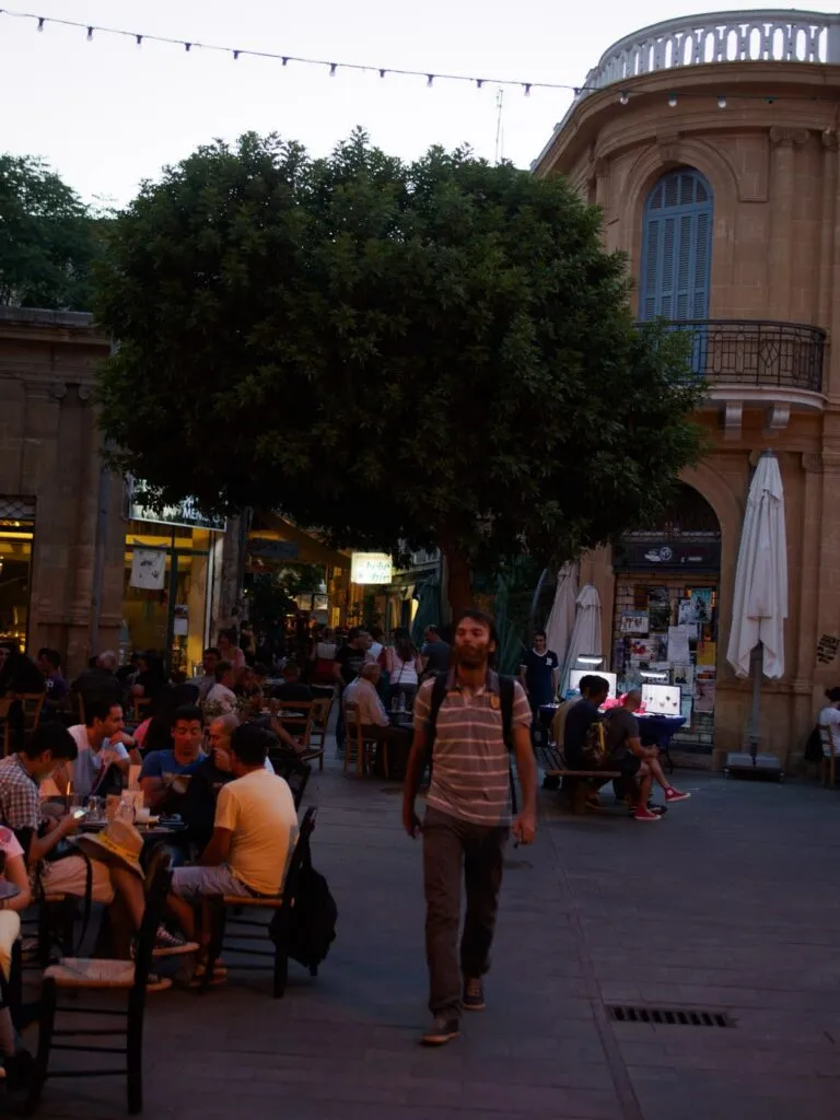 pair Cafe tables under the big tree on Ledra Street