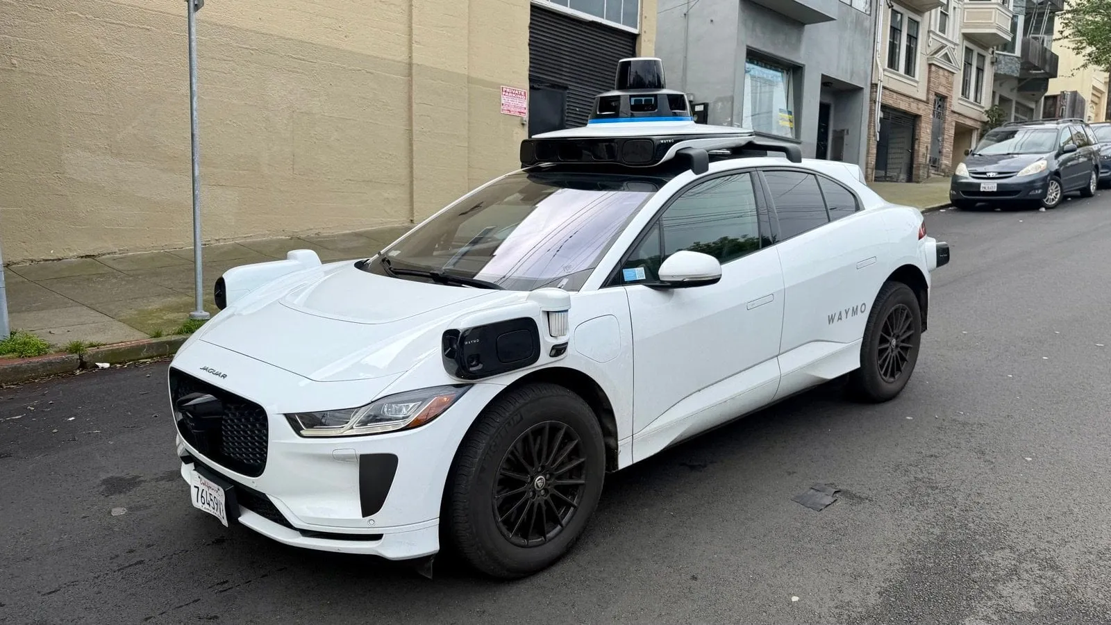 half Waymo autonomous vehicle on San Francisco street