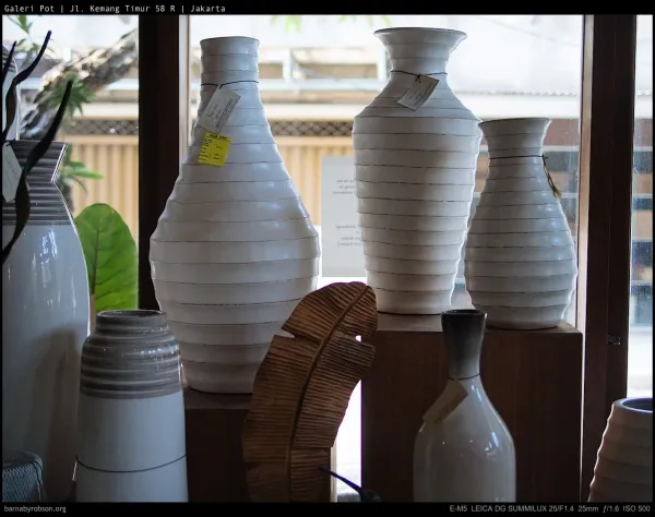 A row of white ceramic vases in the Galeri Pot workshop, Kemang Timur.