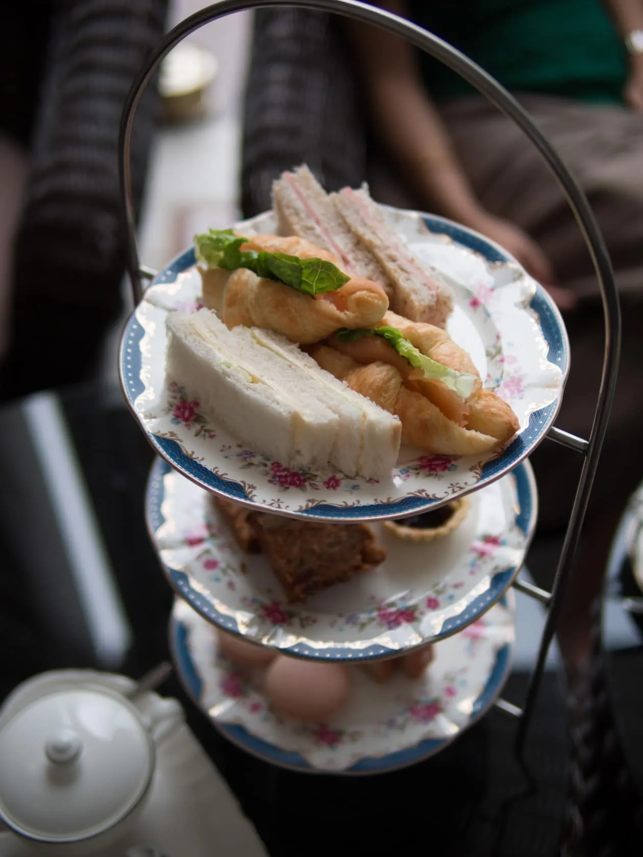 pair Three-tier afternoon-tea stand at Carcosa Seri Negara, finger sandwiches and salmon croissants on the top plate