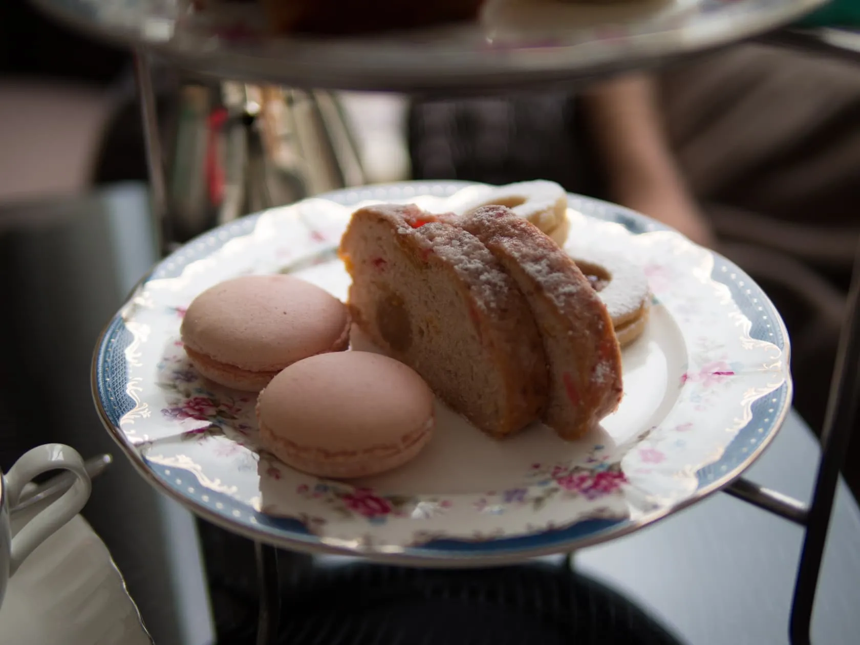 pair Pink macarons and sugar-dusted stollen on floral china at Carcosa Seri Negara